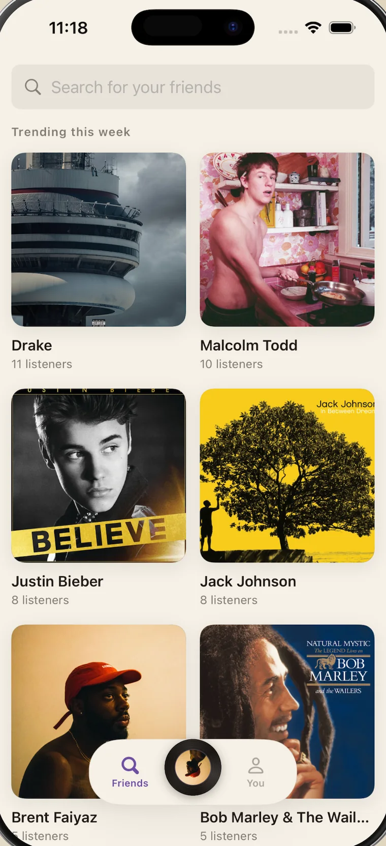 Cue's Friends tab: a search field reading "Search for your friends", and a Trending this week grid of artists — Drake, Malcolm Todd, Justin Bieber, Jack Johnson — each with a listener count.
